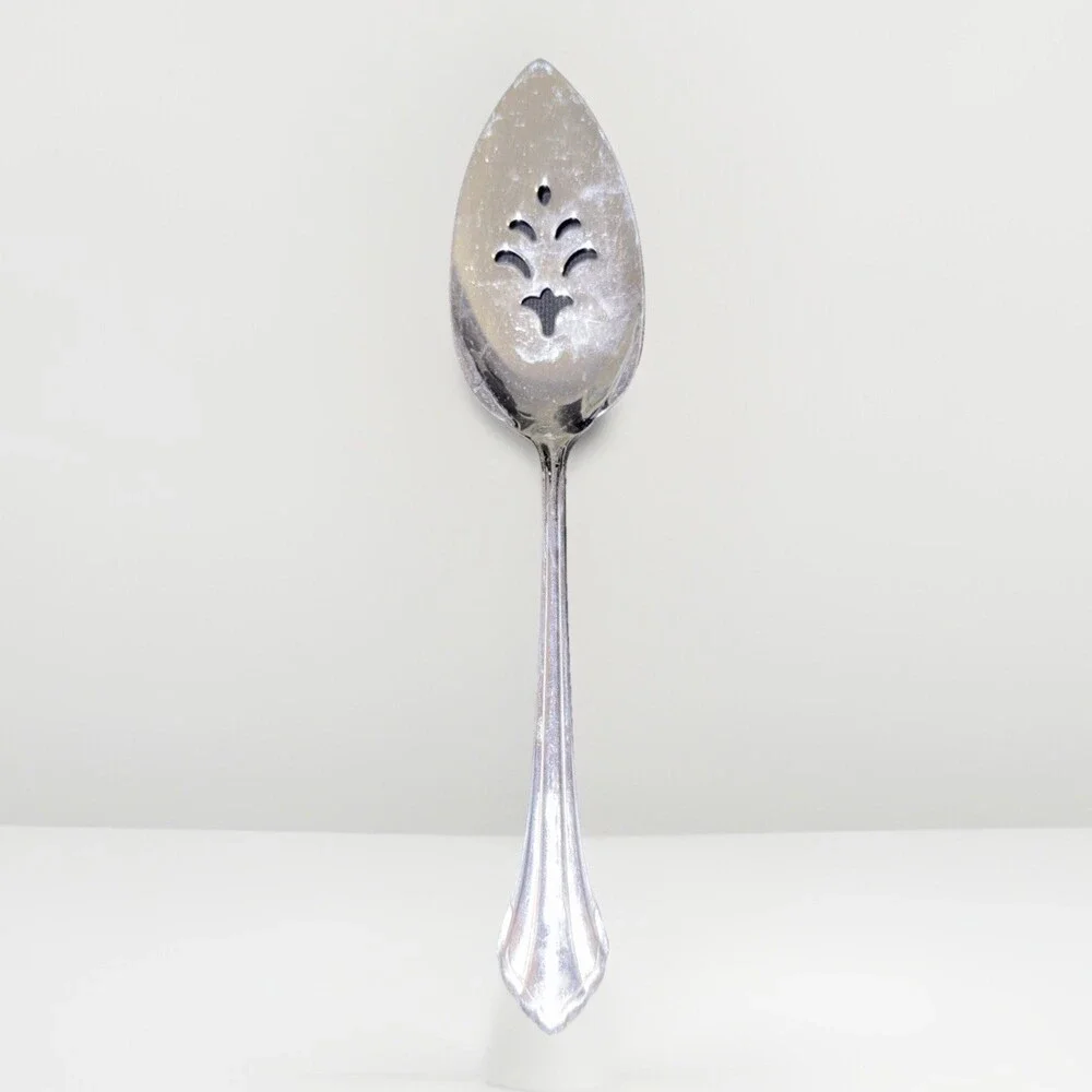 Oneida Community Royal Flute pierced pie server in stainless steel. 9.5”